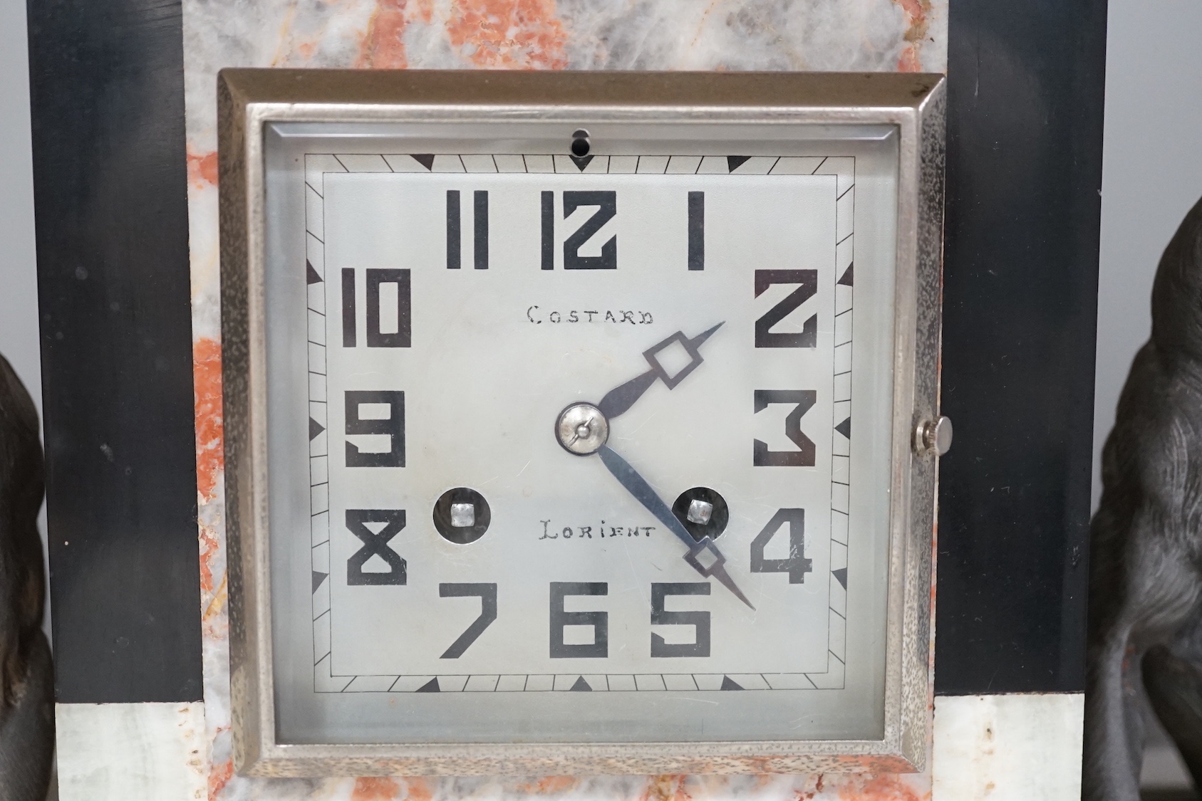 An Art Deco French spelter and marble mantel clock, 46cm wide